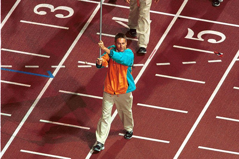 Paralympian Brendan Burkett holds the Australian flag at the Sydney 2000 Paralympic Opening Ceremony.